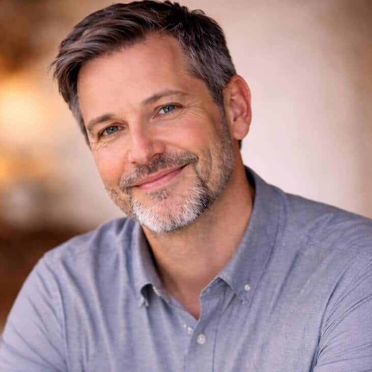 GraceVoice Smiling man with short gray hair